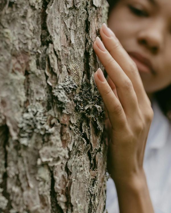 Woman feeling energetic and balanced in a calm environment.